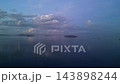 Twilight Calm Sea With Island Silhouettes, Purpleblue Dusk Light And Glassy Reflections, Tranquil Evening Mood 143898244