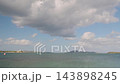 Turquoise Bay Under Heavy Cloud, Shallow Clear Water With Distant Buoys And Islands, Soft Overcast Light 143898245