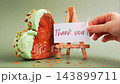 THANK YOU text thanksgiving day Delightful and vibrant heartshaped pastry croissant treat, beautifully topped with colorful frosting nut galore. Mock up template copy space. Food experimentation viral 143899711