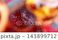Tea Cup Reflecting Autumn Trees and Sky During Outdoor Picnic 143899712