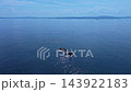 夏の朝にドローンで東京湾の海鹿島灯台を中心に旋回し横須賀から房総まで見渡す姿を捉えた4K空撮動画風景 143922183
