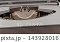 Typewriter mechanism close-up showing keys, levers, and inner workings in detail 143928016