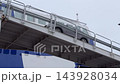 Cars entering ferry at Tallinna sadamas, loading ramp visible from below 143928034