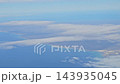 Argentina - October 11, 2026: View of the coastal landscape from a passenger aircraft flying over Patagonia, with clouds above the land and water in natural daylight. 143935045