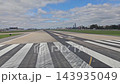 Buenos Aires, Argentina - October 11, 2026: Ground-level view of airport runway pavement and adjacent airfield from a passenger aircraft preparing for departure. 143935049