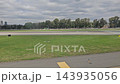 Buenos Aires, Argentina - October 11, 2026: Passenger window view of paved taxiway surfaces and airport grounds during ground movement before departure. 143935056