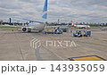 Buenos Aires, Argentina - October 11, 2026: View of airport ground handling equipment positioned near a passenger aircraft, with apron infrastructure and service vehicles visible. 143935059