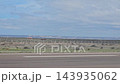 Trelew, Argentina - October 11, 2026: View from a passenger airplane window after landing, showing the airport pavement, airfield infrastructure and surrounding terrain. 143935062