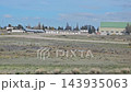 Trelew, Argentina - October 11, 2026: View from a passenger aircraft after landing, showing airport hangars, paved airfield surfaces and aviation facilities at Trelew Airport in Patagonia. 143935063