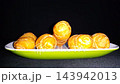 Pisang Molen Indonesian Fried Banana Rolls on Plate. served on a plate against a dark background. 143942013