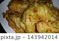 Crispy Indonesian Bakwan Fritters on White Plate with Copy Space 143942014