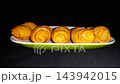 Golden Fried Banana Molen Indonesian Street Food Snack, This traditional pastry, filled with sweet banana, is perfect for food blogs, menus, or advertising.  143942015