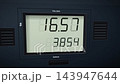 Close Up View of Digital Gas Pump Display Counting Fuel Price and Gallons Purchased Rapidly 143947644