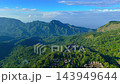 Aerial view of traditional Bena village houses with thatched roofs surrounded by green tropical 143949644