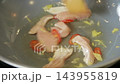 Chicken strips frying in a wok with chili and ginger 143955819