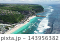 Scenic landscape with cliff coastline, sandy beach with blue ocean and waves. Aerial view. High quality 4k footage 143956382