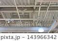 High ceilings with rotating ceiling fans and air conditioning equipment High ceilings with rotating ceiling fans and air conditioning equipment 143966342