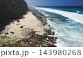 Scenic landscape with cliff coastline, sandy beach with blue ocean and waves. Aerial view. High quality 4k footage 143980268