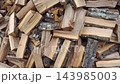 Log piled. Chopped logs firewood for winter heating 143985003