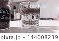 Chia Seed Gel Forming in Water: Hydrated Seed Swelling Demonstration for Gut Health 144008239