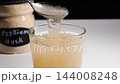 Textured psyllium husk gel formation in water showcased in a studio shot demonstration 144008248