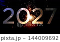 2027 new year translucent silver number overlay with ground firework fountain sparks on dark night 144009692